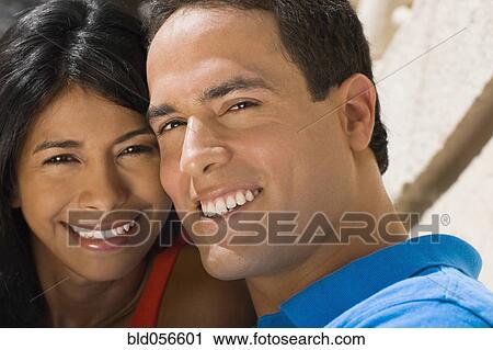 Stock Image - Close up of Hispanic couple smiling. Fotosearch