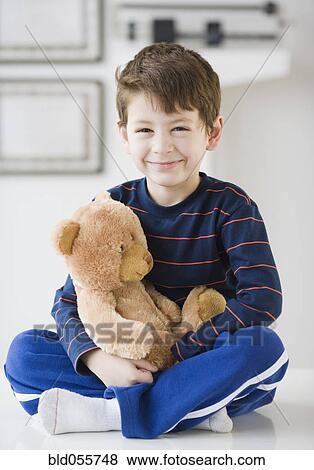 Hispanic boy with teddy bear in doctor’s office View Large Photo Image Stock Photo - Hispanic boy with teddy bear in doctor’s office. Fotosearch