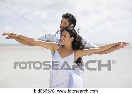 Stock Photo - Hispanic couple dancing at beach. Fotosearch