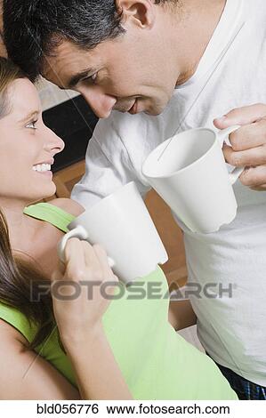 Stock Photograph - Hispanic couple drinking coffee. Fotosearch