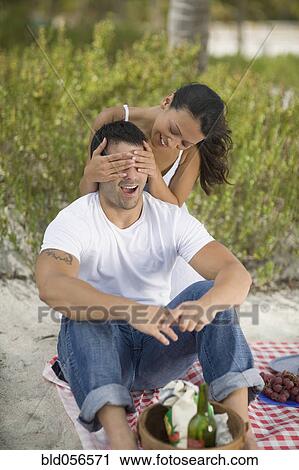 Stock Image - Hispanic couple having picnic. Fotosearch