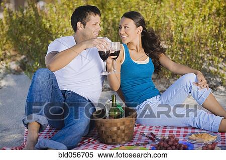 Stock Photography - Hispanic couple having picnic. Fotosearch