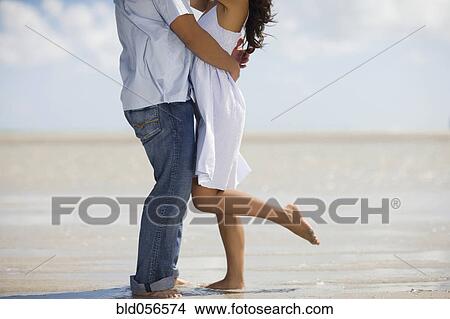Hispanic couple hugging View Large Photo Image Picture - Hispanic couple hugging. Fotosearch