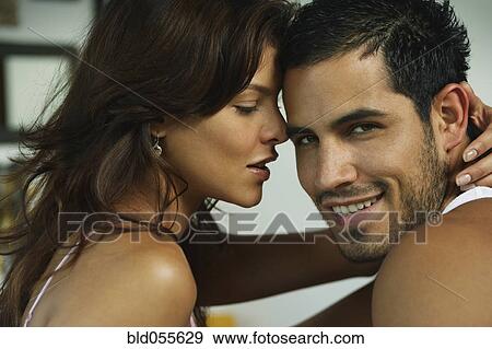 Hispanic couple hugging View Large Photo Image Stock Photo - Hispanic couple hugging. Fotosearch