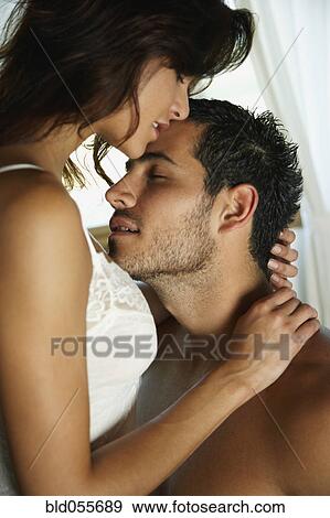 Stock Photo - Hispanic couple hugging. Fotosearch