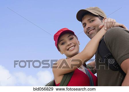Hispanic couple hugging View Large Photo Image Stock Photo - Hispanic couple hugging. Fotosearch
