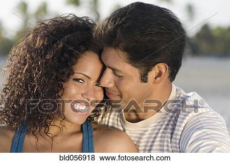 Stock Photo - Hispanic couple hugging. Fotosearch