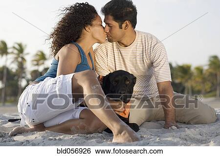 Stock Photograph - Hispanic couple kissing. Fotosearch