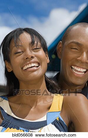 Stock Photo - Hispanic couple laughing. Fotosearch