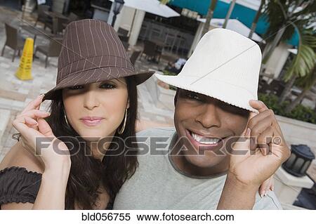 Hispanic couple wearing hats View Large Photo Image Stock Photography - Hispanic couple wearing hats. Fotosearch