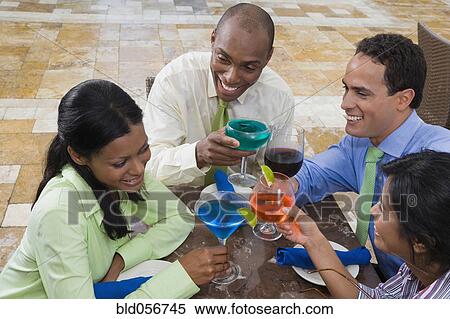 Hispanic couples toasting with cocktails View Large Photo Image Stock Photography - Hispanic couples toasting with cocktails. Fotosearch