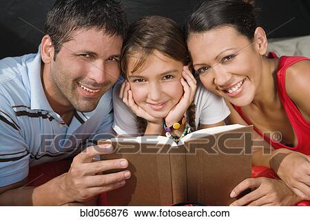 Hispanic family reading View Large Photo Image Stock Photograph - Hispanic family reading. Fotosearch