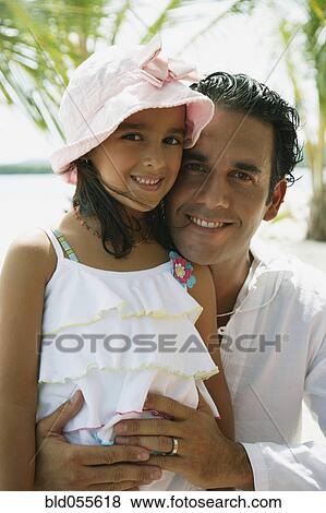 Hispanic father and daughter hugging View Large Photo Image Stock Photo - Hispanic father and daughter hugging. Fotosearch