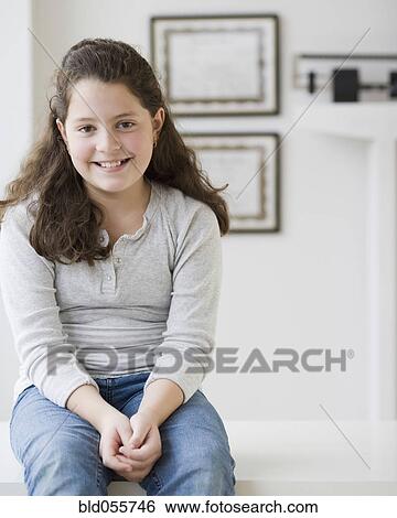 Stock Photograph - Hispanic girl in doctor’s office. Fotosearch