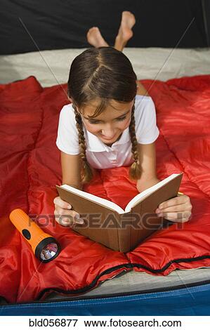Hispanic girl reading View Large Photo Image Stock Photo - Hispanic girl reading. Fotosearch
