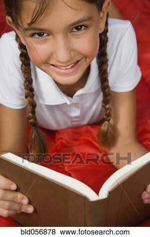 Hispanic girl reading View Large Photo Image Stock Photo - Hispanic girl reading. Fotosearch