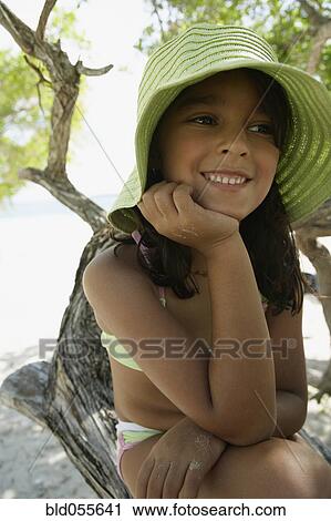 Hispanic girl wearing hat at beach View Large Photo Image Stock Image - Hispanic girl wearing hat at beach. Fotosearch