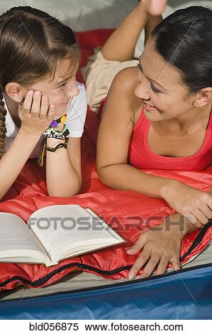 Hispanic mother and daughter smiling at each other View Large Photo Image Stock Photography - Hispanic mother and daughter smiling at each other. Fotosearch