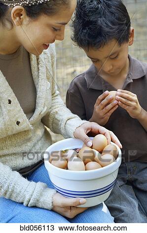 Hispanic mother and son with bowl of eggs View Large Photo Image Stock Image - Hispanic mother and son with bowl of eggs. Fotosearch