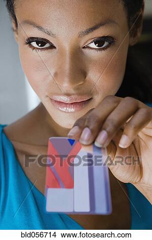 Hispanic woman holding credit card View Large Photo Image Picture - Hispanic woman holding credit card. Fotosearch