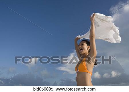 Hispanic woman in bikini holding skirt in wind View Large Photo Image Stock Photography - Hispanic woman in bikini holding skirt in wind. Fotosearch