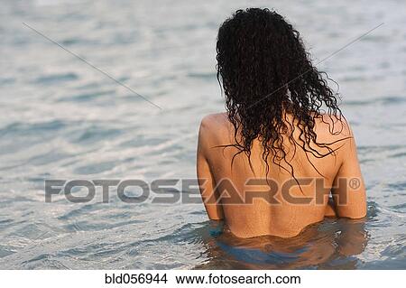 Picture - Hispanic woman in water. Fotosearch