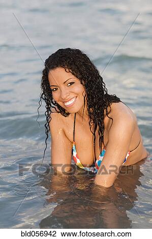 Hispanic woman in water View Large Photo Image Stock Image - Hispanic woman in water. Fotosearch