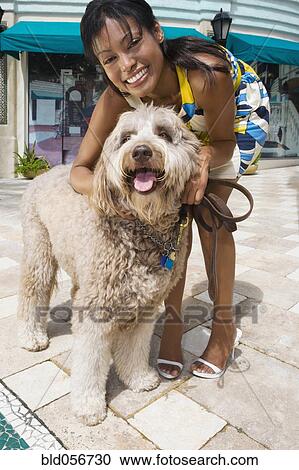 Hispanic woman petting dog View Large Photo Image Stock Image - Hispanic woman petting dog. Fotosearch
