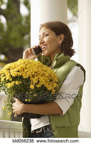 Hispanic woman talking on cell phone View Large Photo Image Stock Photo - Hispanic woman talking on cell phone. Fotosearch