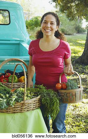Hispanic women at organic farm stand View Large Photo Image Stock Photograph - Hispanic women at organic farm stand. Fotosearch