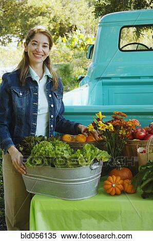 Stock Photography - Middle Eastern women at organic farm stand. Fotosearch