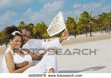 Multi-ethnic bride and groom at beach View Large Photo Image Stock Photo - Multi-ethnic bride and groom at beach. Fotosearch