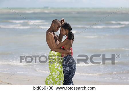 Multi-ethnic couple dancing at beach View Large Photo Image Stock Image - Multi-ethnic couple dancing at beach. Fotosearch