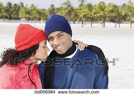 Multi-ethnic couple hugging View Large Photo Image Picture - Multi-ethnic couple hugging. Fotosearch