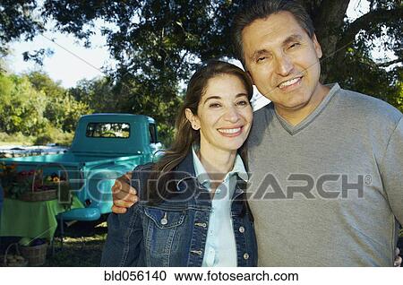 Multi-ethnic couple hugging View Large Photo Image Stock Image - Multi-ethnic couple hugging. Fotosearch