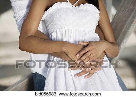 Multi-ethnic couple hugging View Large Photo Image Stock Image - Multi-ethnic couple hugging. Fotosearch