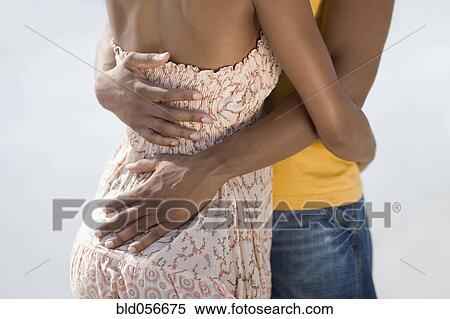 Multi-ethnic couple hugging View Large Photo Image Stock Photography - Multi-ethnic couple hugging. Fotosearch