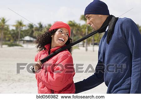 Multi-ethnic couple smiling at each other View Large Photo Image Stock Image - Multi-ethnic couple smiling at each other. Fotosearch