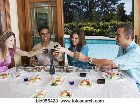 Multi-ethnic couples eating sushi View Large Photo Image Stock Image - Multi-ethnic couples eating sushi. Fotosearch