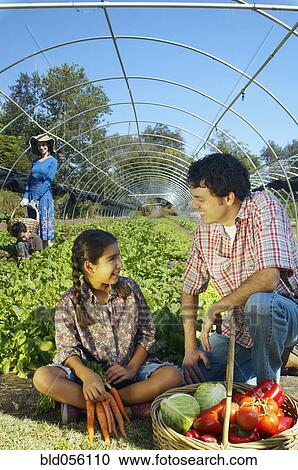 Multi-ethnic father and daughter with organic produce View Large Photo Image Stock Image - Multi-ethnic father and daughter with organic produce. Fotosearch
