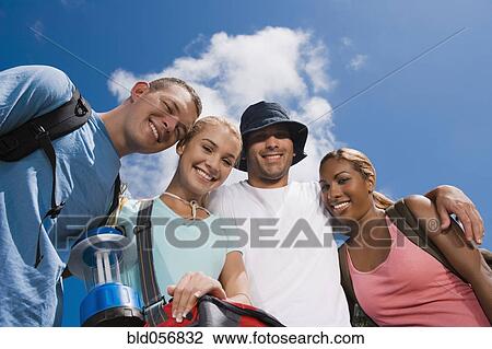 Multi-ethnic friends hugging View Large Photo Image Stock Image - Multi-ethnic friends hugging. Fotosearch