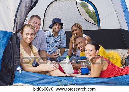 Multi-ethnic friends in tent View Large Photo Image Stock Image - Multi-ethnic friends in tent. Fotosearch