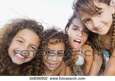 Multi-ethnic girls being silly View Large Photo Image Stock Image - Multi-ethnic girls being silly. Fotosearch