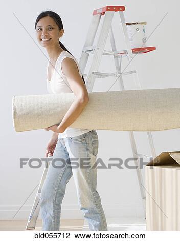 Pacific Islander woman carrying rug View Large Photo Image Stock Image - Pacific Islander woman carrying rug. Fotosearch