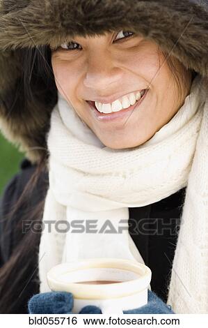 Pacific Islander woman drinking hot chocolate View Large Photo Image Stock Photograph - Pacific Islander woman drinking hot chocolate. Fotosearch