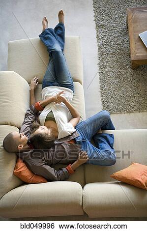 African American couple laying on sofa View Large Photo Image Stock Photograph - African American couple laying on sofa. Fotosearch
