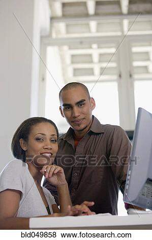 African American couple next to computer View Large Photo Image Stock Photo - African American couple next to computer. Fotosearch