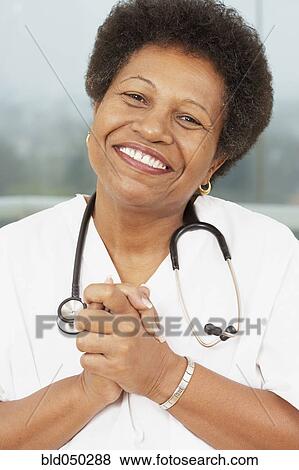 African American female doctor with hands clasped View Large Photo Image Stock Photo - African American female doctor with hands clasped. Fotosearch