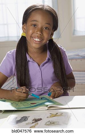 African American girl doing homework View Large Photo Image Stock Photograph - African American girl doing homework. Fotosearch