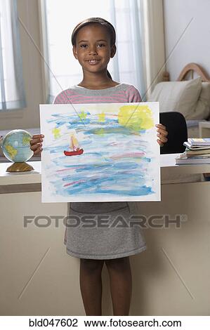 African American girl holding painting View Large Photo Image Stock Image - African American girl holding painting. Fotosearch